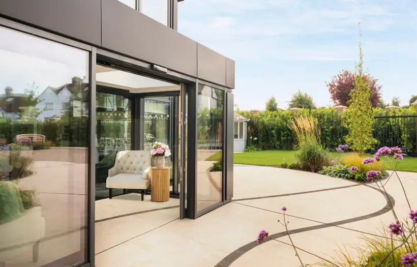 Garden space at Place Farm House, showcasing a patterned floor and planting areas
